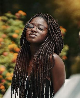 woman with locs wearing glasses